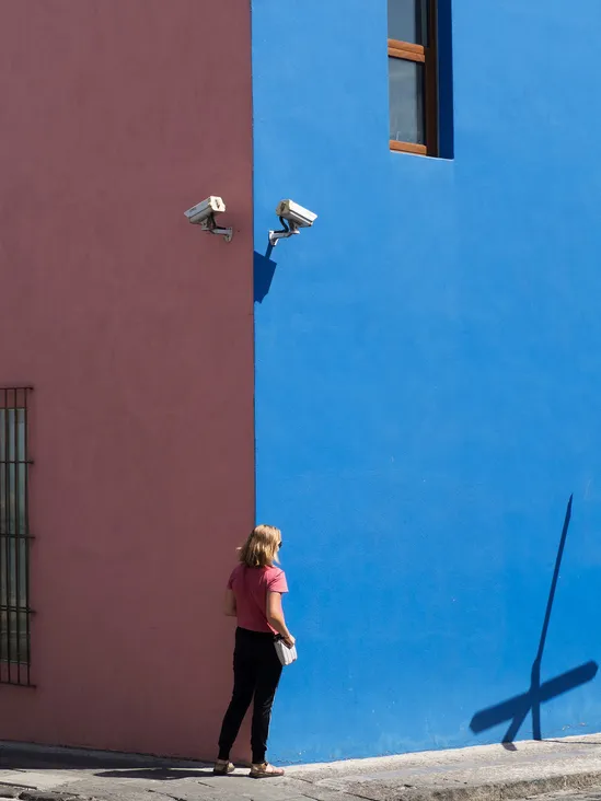 Hiding underneath security cameras