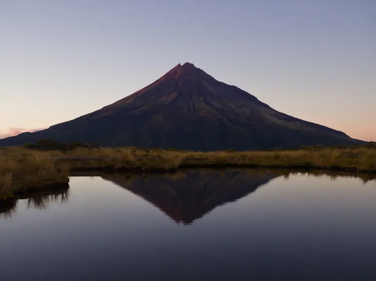 The maunga reflected in the tarn along the Pouakai Circuit
