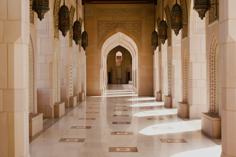 A polished and shaded hallway in the Grand Mosque